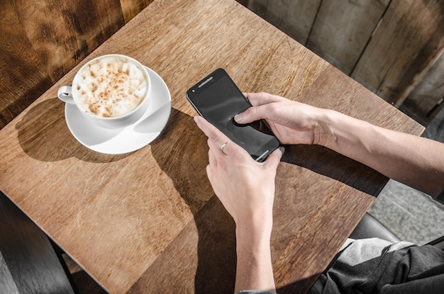 high angle view of woman using smart phone