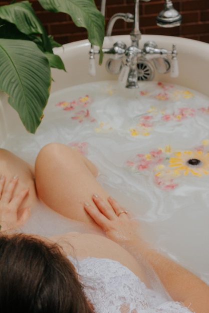 high angle view of woman washing hands in bathtub