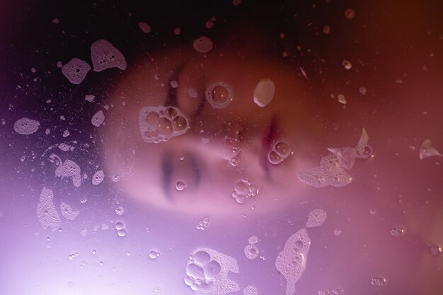 Photo high angle view of woman with eyes closed in bathtub