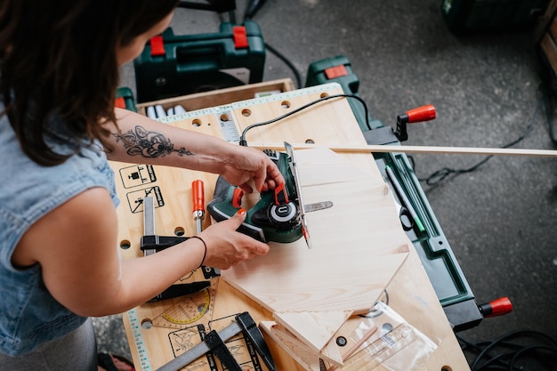 high angle view of woman working in workshop