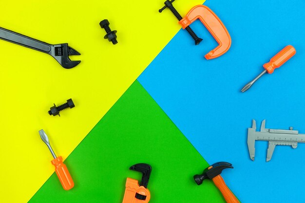 High angle view of work tools against colored background