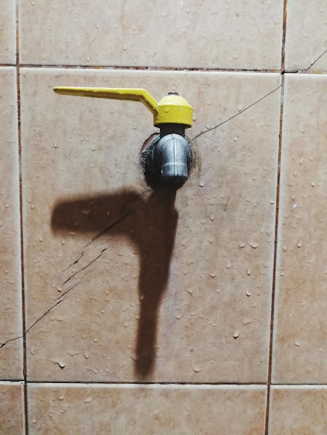 High angle view of yellow bicycle on tiled floor