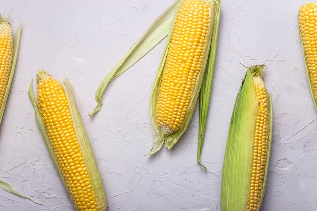 High angle view of yellow corn on gray table