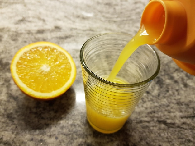 High angle view of yellow drink on table