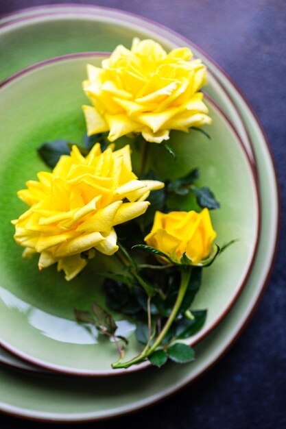 High angle view of yellow flowers in bowl on table