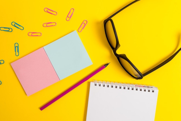 High angle view of yellow and pen on table