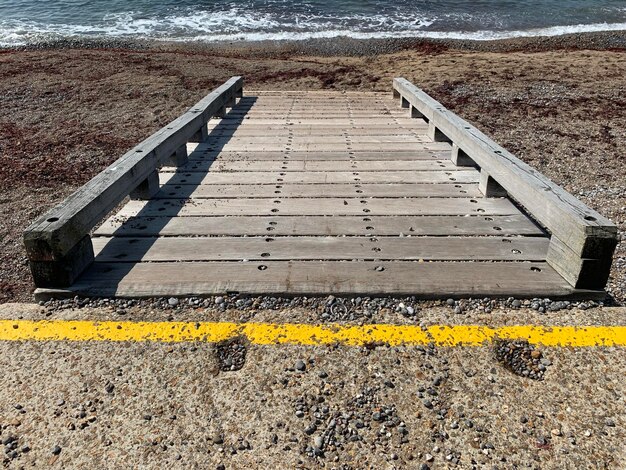 High angle view of yellow text on beach