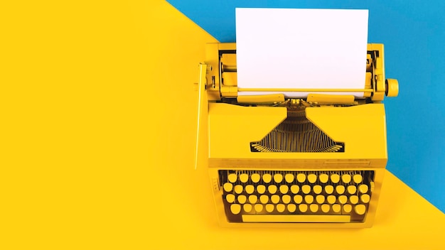 High angle view of yellow typewriter on table