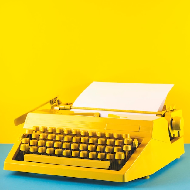 High angle view of yellow typewriter on table