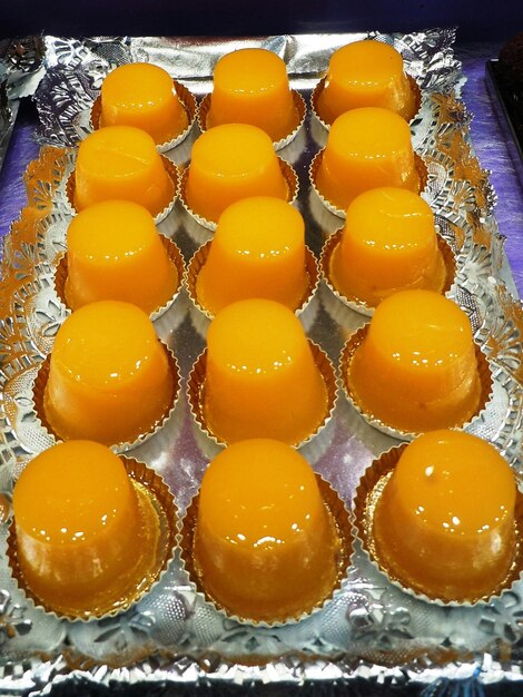 High angle view of yellow vanilla ice cream pieces on table