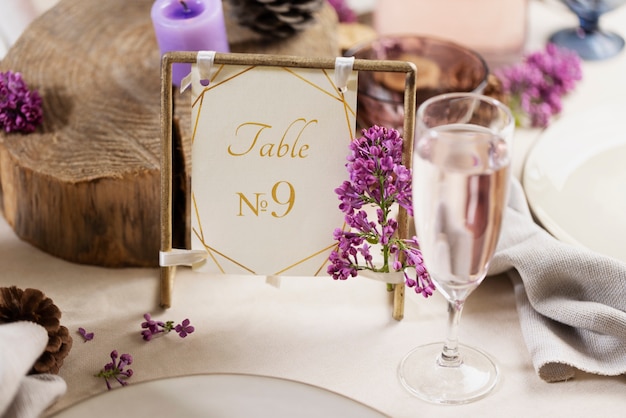 high angle wedding table with purple candles and card