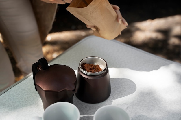 Photo high angle woman making coffee