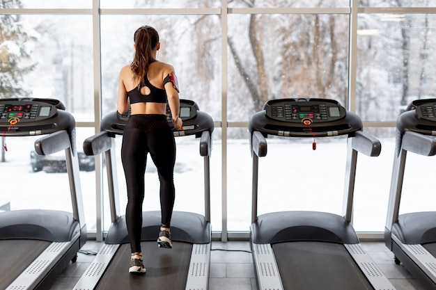 High angle woman running on treadmill