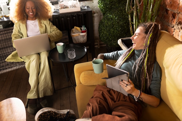 High angle women reading in cafe