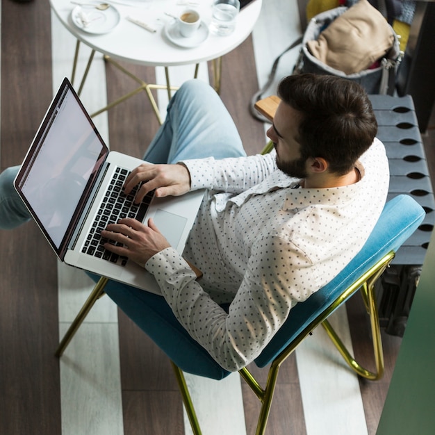 High angle young business man working