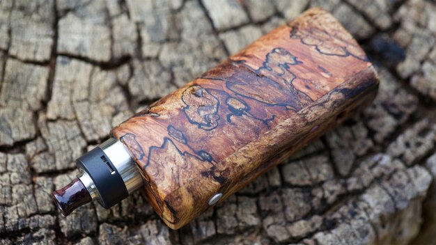 High end natural stabilized wood box mods with rebuildable dripping atomizer, vaping device, selective focus