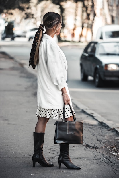 High fashion portrait of young elegant woman outdoor