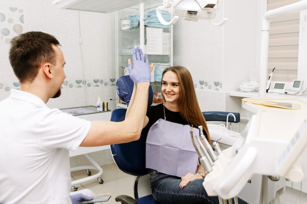 High five. The client is happy to see you at the dentists office