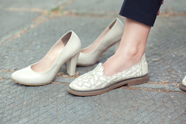 High and flat shoes in street