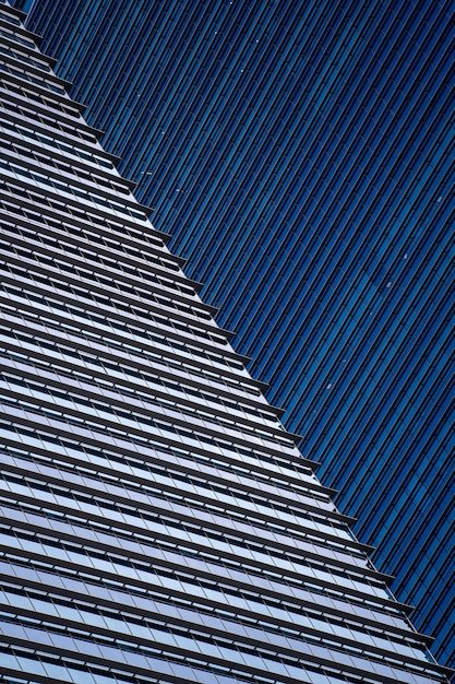 High glass skyscrapers on the streets of Singapore. Office windows background, closeup