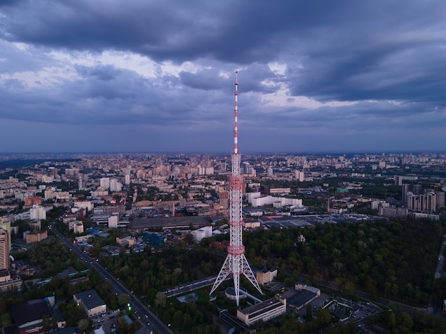 High metal tv tower in the city