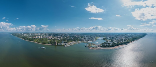 High resolution stitched panorama of a scenic aerial view of Cheboksary capital city of Chuvashia Russia and a port on the Volga River on sunny summer day