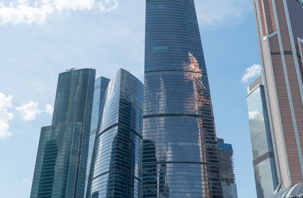 High rise buildings of the business center of Moscow. District Moscow-city against the day sky with clouds