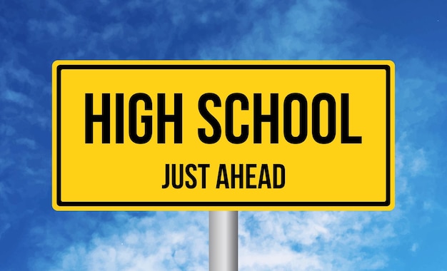 Photo high school just ahead road sign on sky background