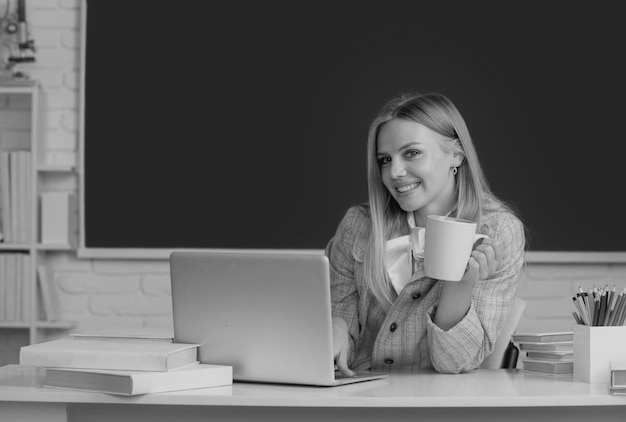 High school student with cup learning english or mathematics in class