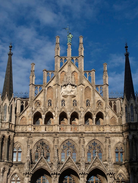 High section of built structure against blue sky and clouds