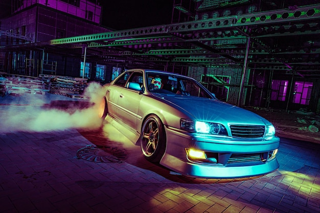 High speed night drift with customized sports car in urban setting