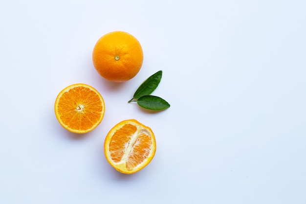 High vitamin C. Fresh orange citrus fruit with leaves isolated on white