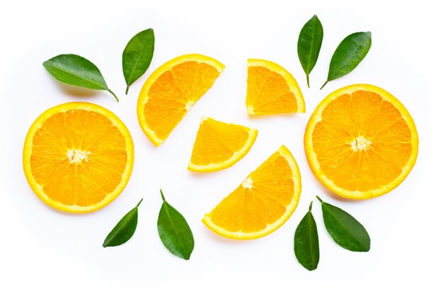 High vitamin C. Fresh orange citrus fruit with leaves isolated on white.