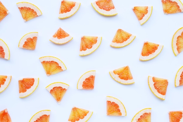 High vitamin C. Juicy grapefruit slices on white surface.