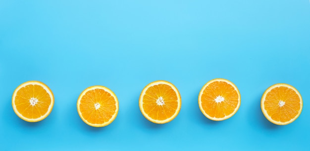 High vitamin C, Juicy and sweet. Fresh orange fruit  on blue background.