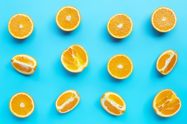 High vitamin C, Juicy and sweet. Fresh orange fruit  on blue background.