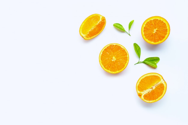 High vitamin C, Juicy and sweet. Fresh orange fruit with green leaves. Background with copyspace