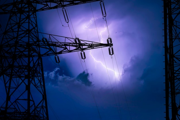 high voltage cable tower in a lightning storm