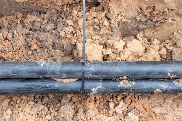 The high voltage electrical cable is laid in a trench under
existing engineering sewerage networks laying a high voltage cable
for supplying buildings with electricity