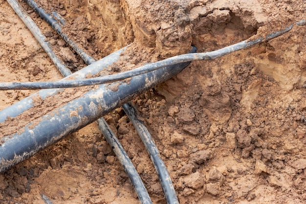 The high voltage electrical cable is laid in a trench under
existing engineering sewerage networks laying a high voltage cable
for supplying buildings with electricity