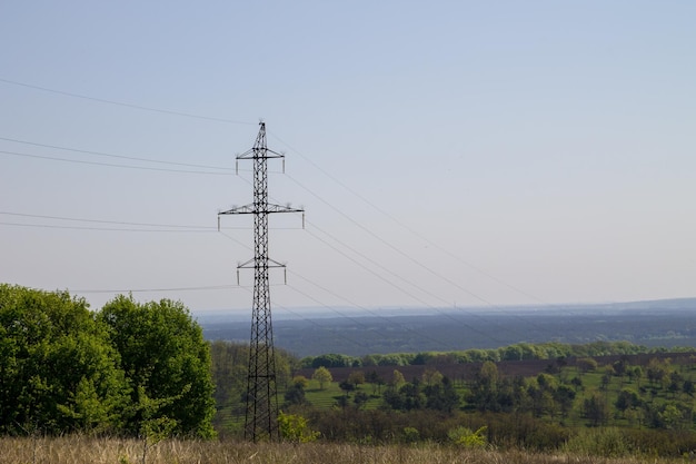 High voltage power line against blue sky