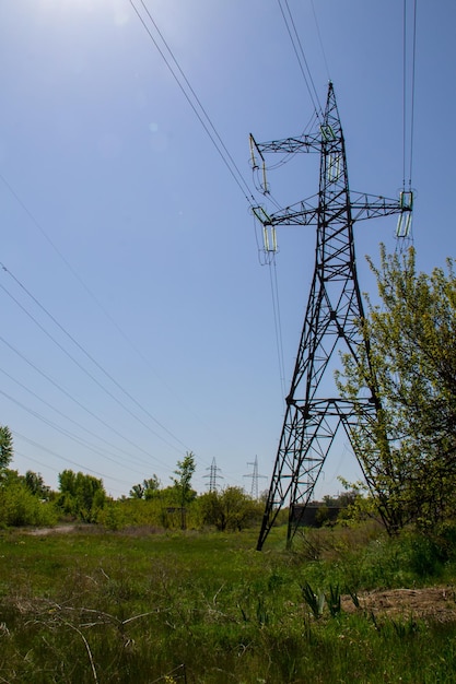 High voltage power line against blue sky