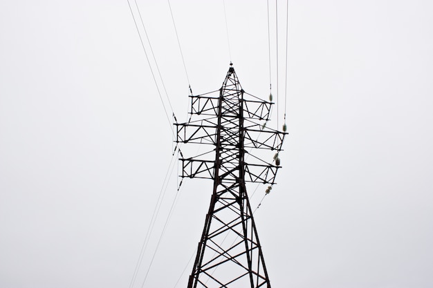 high-voltage power lines at sunset. electricity station