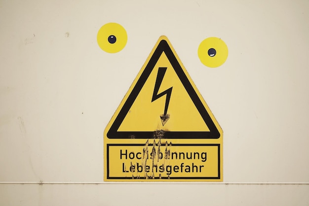 High voltage sign on wall