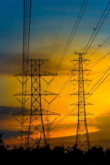 High voltage towers at sunset