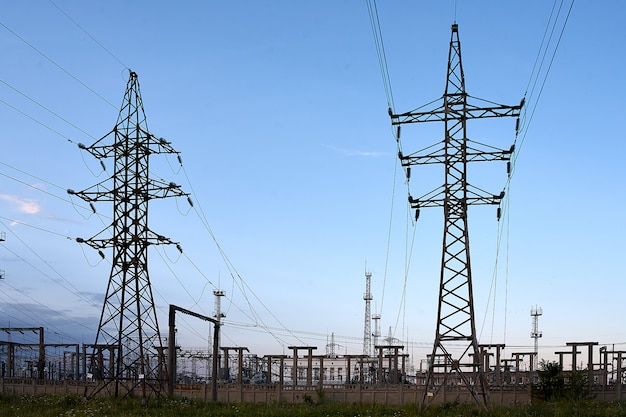 High voltage towers with sky.