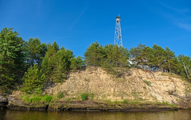 High watchtower on the bank of the river