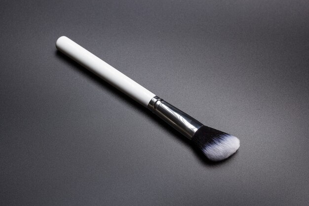 Highlighter make up brush on black background