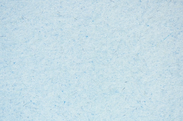 Highly detailed closeup of rough pastel paper texture light blue