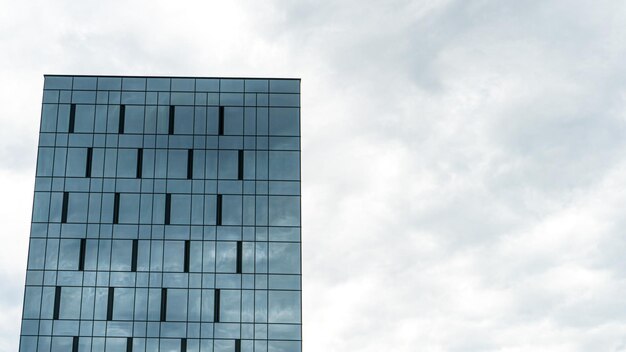 Highrise modern building made of blue glass An unusual glass skyscraper The concept of building modern buildings with futuristic design for business and a happy life